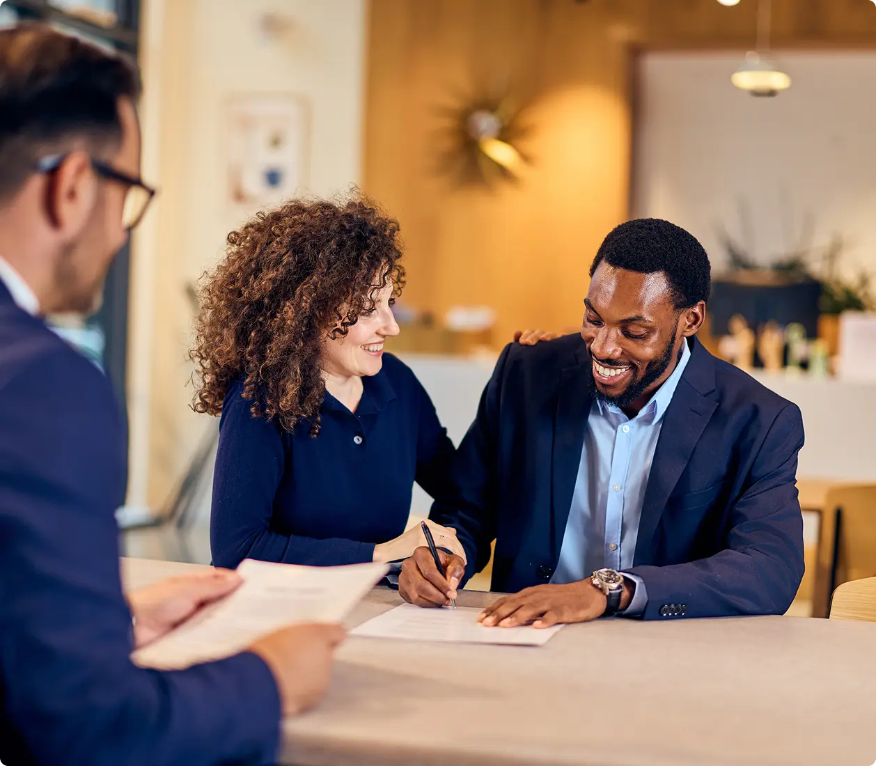 Smiling couple finalizing agreement