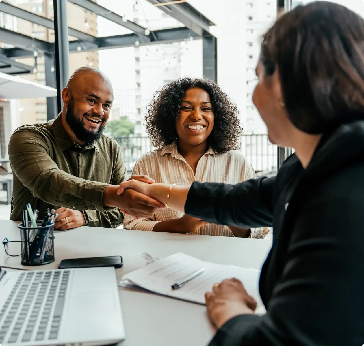 Happy couple meeting with advisor