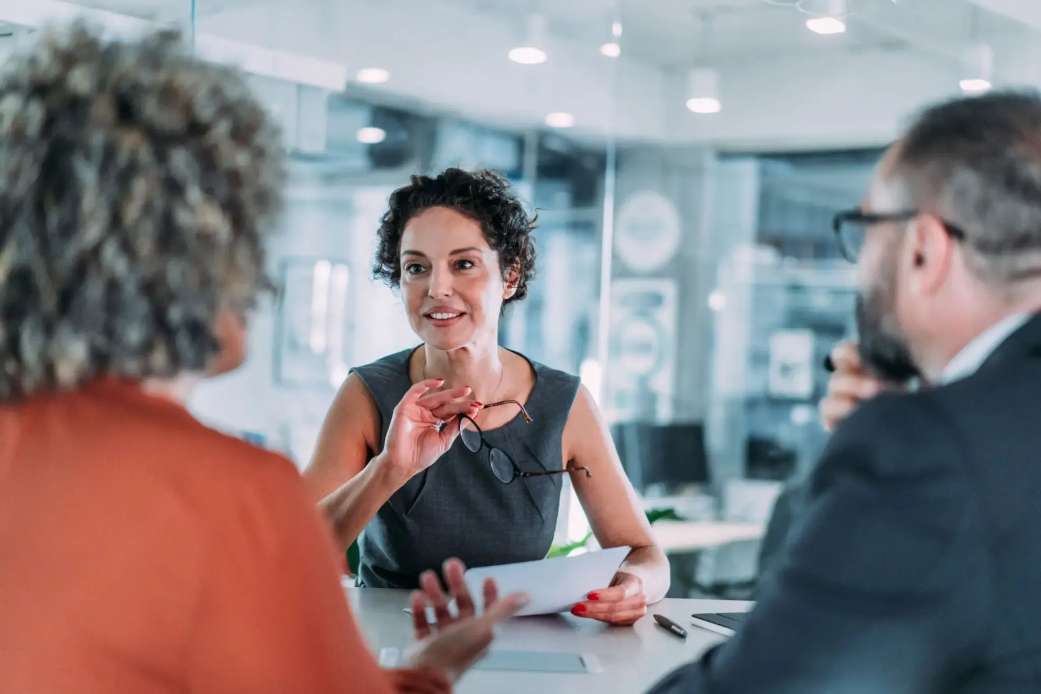 Three people having a business meeting.